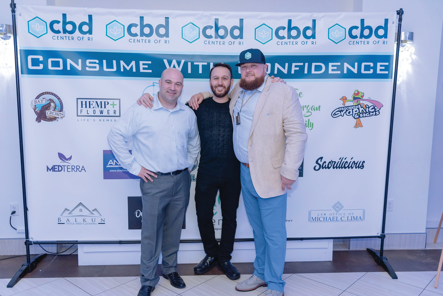 Owners Matt Resnick (l) and Chris Morgan (r) flank Chef David Yusefadeh of Sacrilicious at the CBD Center of RI’s launch party, “Consume with Confidence”, held on April 20th at Skyline at Waterplace. CBD Center is located at 1239 Hartford Avenue in Johnston.